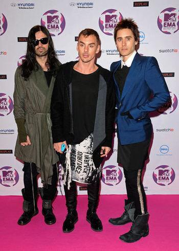 The band Thirty Seconds to Mars, with Tomo Milicevic, left, Shannon Leto and Jared Leto, attends the MTV Europe Music Awards. We're not sure what's worse: the '80s mix-and-match "Working Girl" skirt suit Leto is attempting to rock, the skinny pants or the mittens.