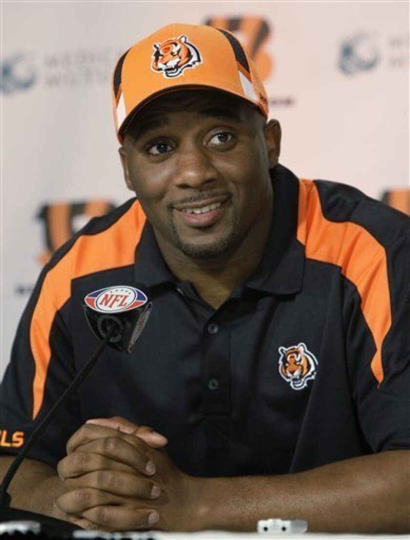 Newly-signed free agent Cincinnati Bengals safety Roy Williams smiles during a news conference at the Bengals NFL football stadium, Thursday, May 7, 2009, in Cincinnati. Williams had gone to five pro bowls during his seven seasons with the Dallas Cowboys. (AP Photo/Al Behrman)