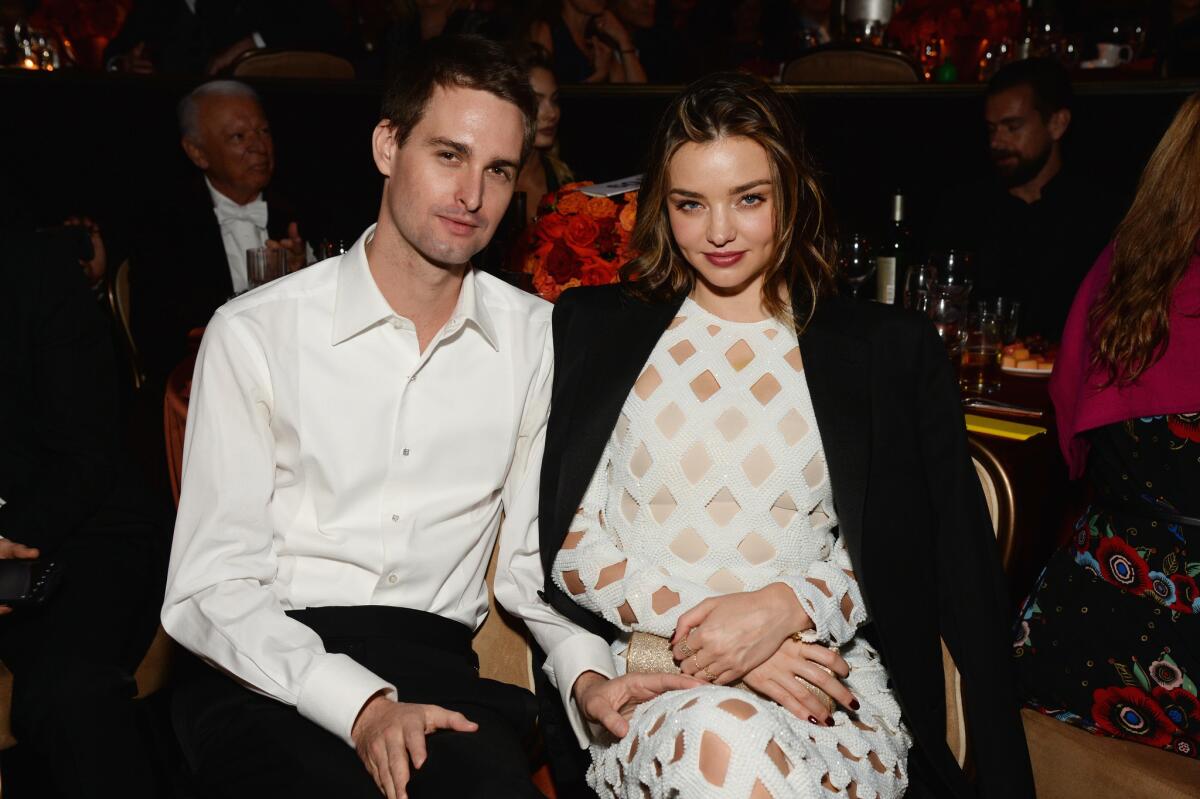 Evan Spiegel and fiancee Miranda Kerr at an event at the Beverly Hilton Hotel last year. (Michael Kovac / WireImage)