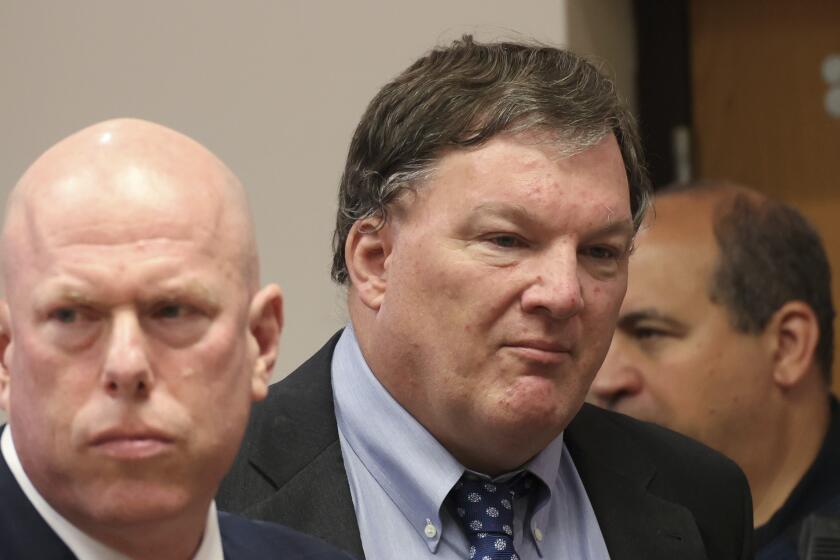 Rex Heuermann, center, charged in the Gilgo Beach serial killings on Long Island, appears for a hearing at Suffolk County Court in Riverhead, N.Y., Thursday, June. 6, 2024. Heuermann was charged Thursday in the deaths of two more, after prosecutors said they gathered new DNA evidence and found a computer document he had used to “blueprint” his crimes. (James Carbone/Newsday via AP, Pool)