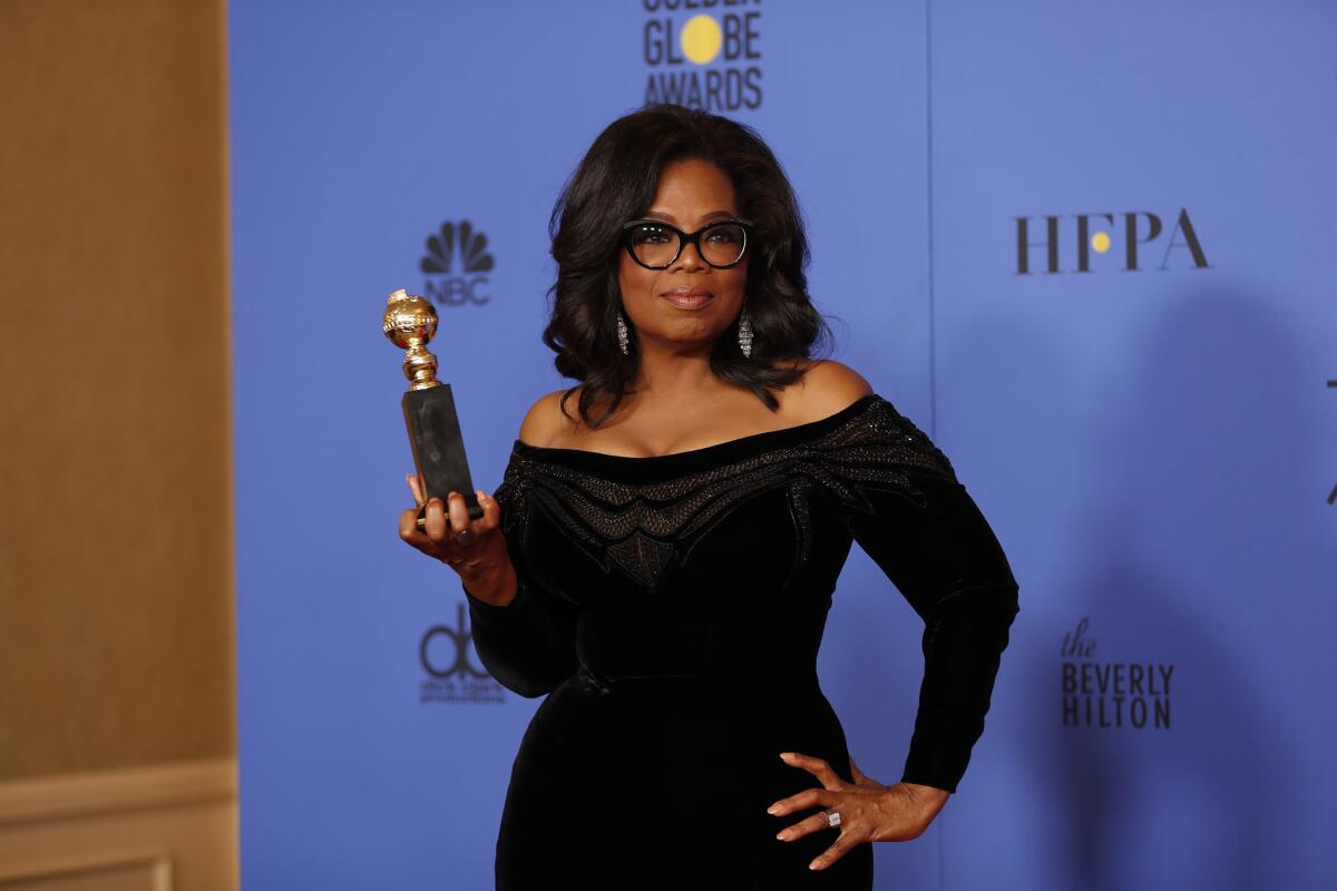Oprah Winfrey, who received the Cecil B. DeMille Award at the Golden Globes, wore an Atelier Versace gown and a Neil Lane diamond and platinum ring on her left hand Sunday.