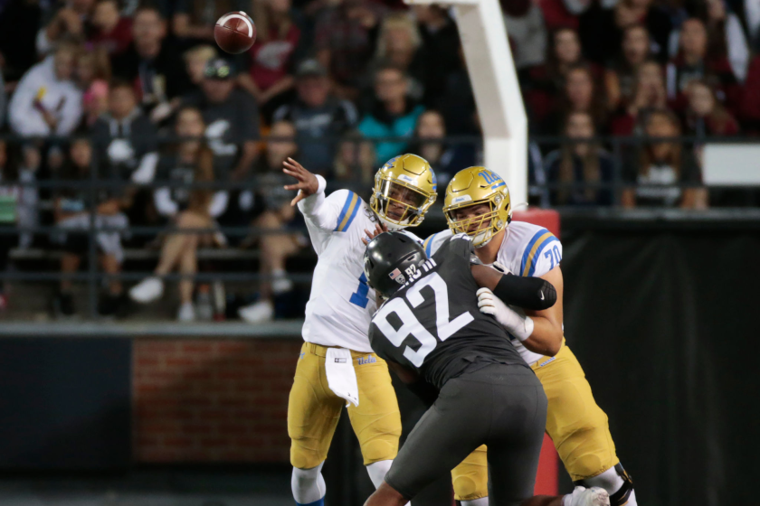 UCLA lineman Alec Anderson protects QB Dorian Thompson-Robinson from the pass rush of Washington State's Will Rodgers III 