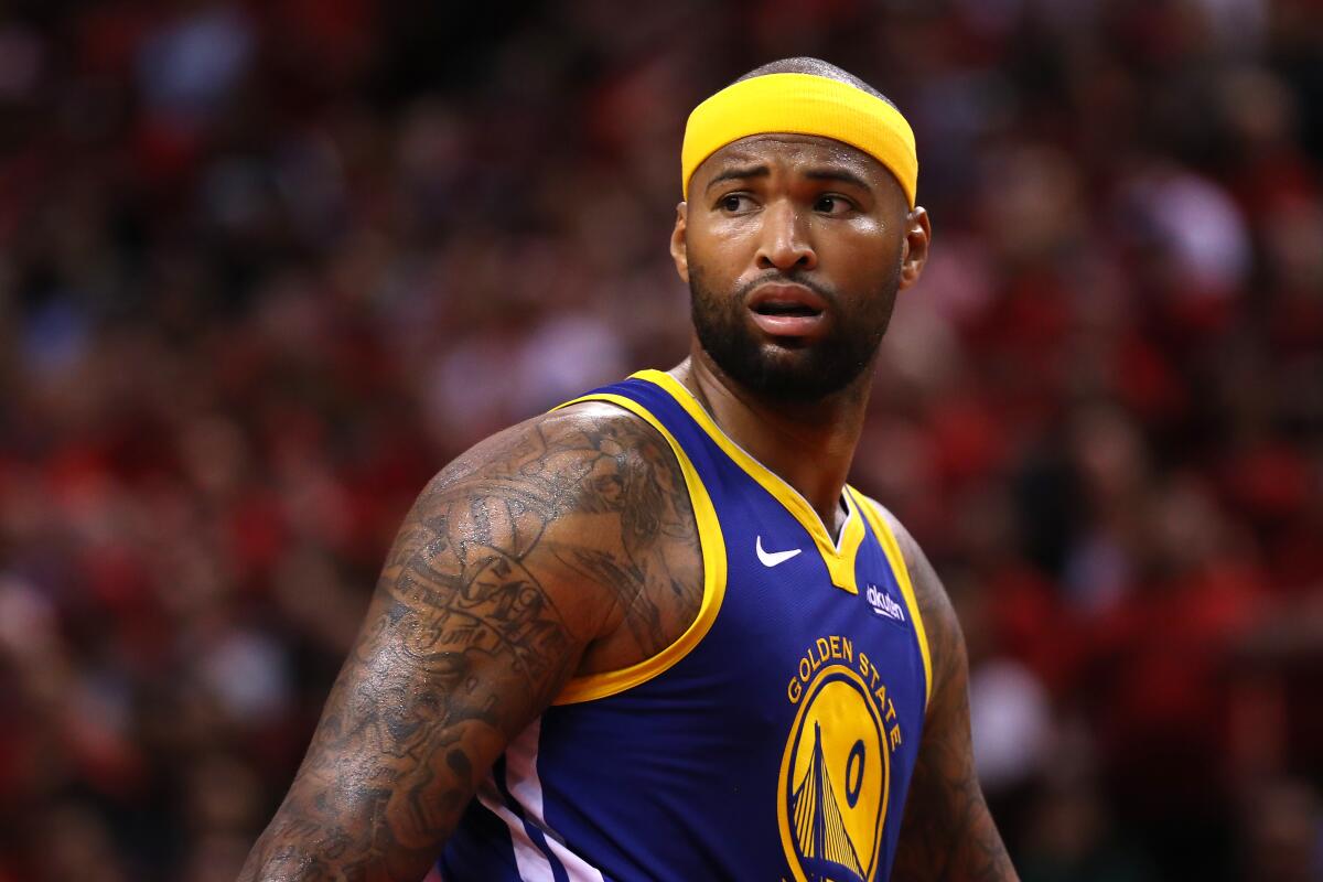 DeMarcus Cousins' former girlfriend has accused the Lakers center of threatening to shoot her.
