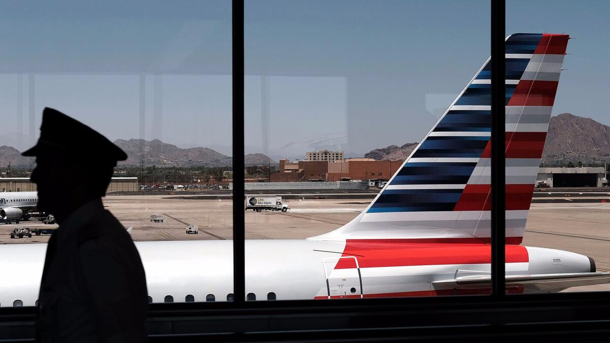 A pilot walks through the Phoenix airport. Boeing predicts the world's airlines will need 617,000 pilots, 679,000 technicians and 814,000 crew members in the next 20 years.
