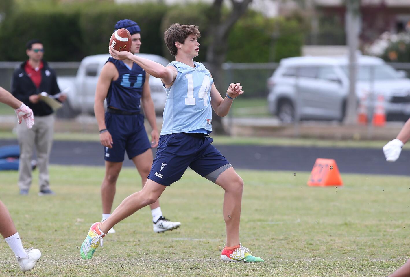 Quarterback Ethan Garbers throws a pass during a spring football showcase at Corona del Mar High on Wednesday.