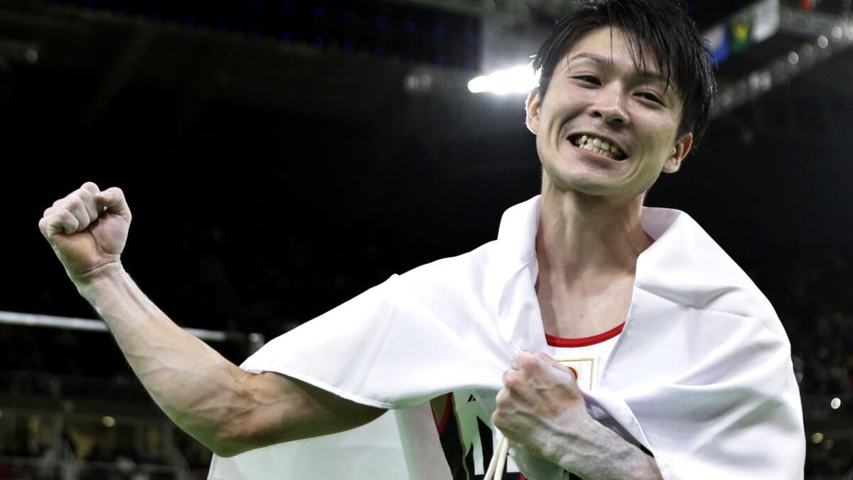 Japan's Kohei Uchimura celebrates Wednesday after winning the gold medal in the men's gymnastics all-around competition.