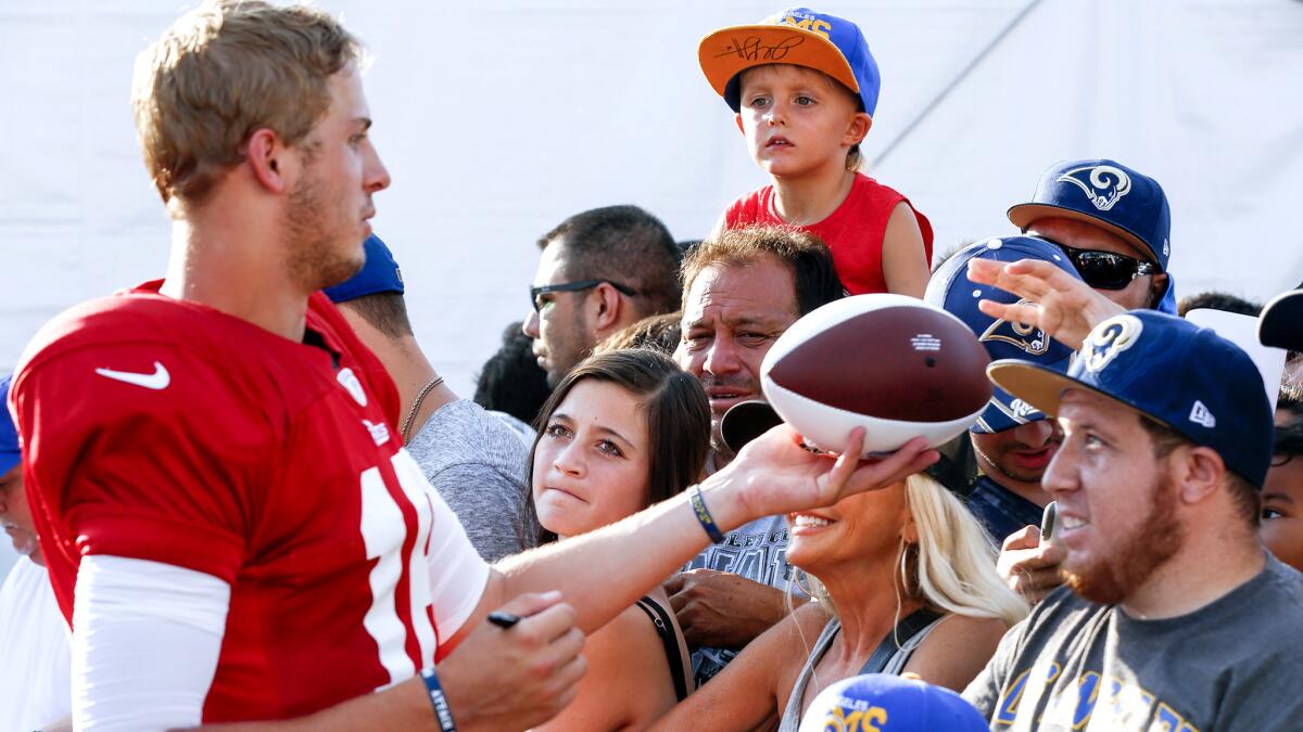 Rams rookie quarterback Jared Goff signs autographs during a practice earlier this week at UC Irvine.