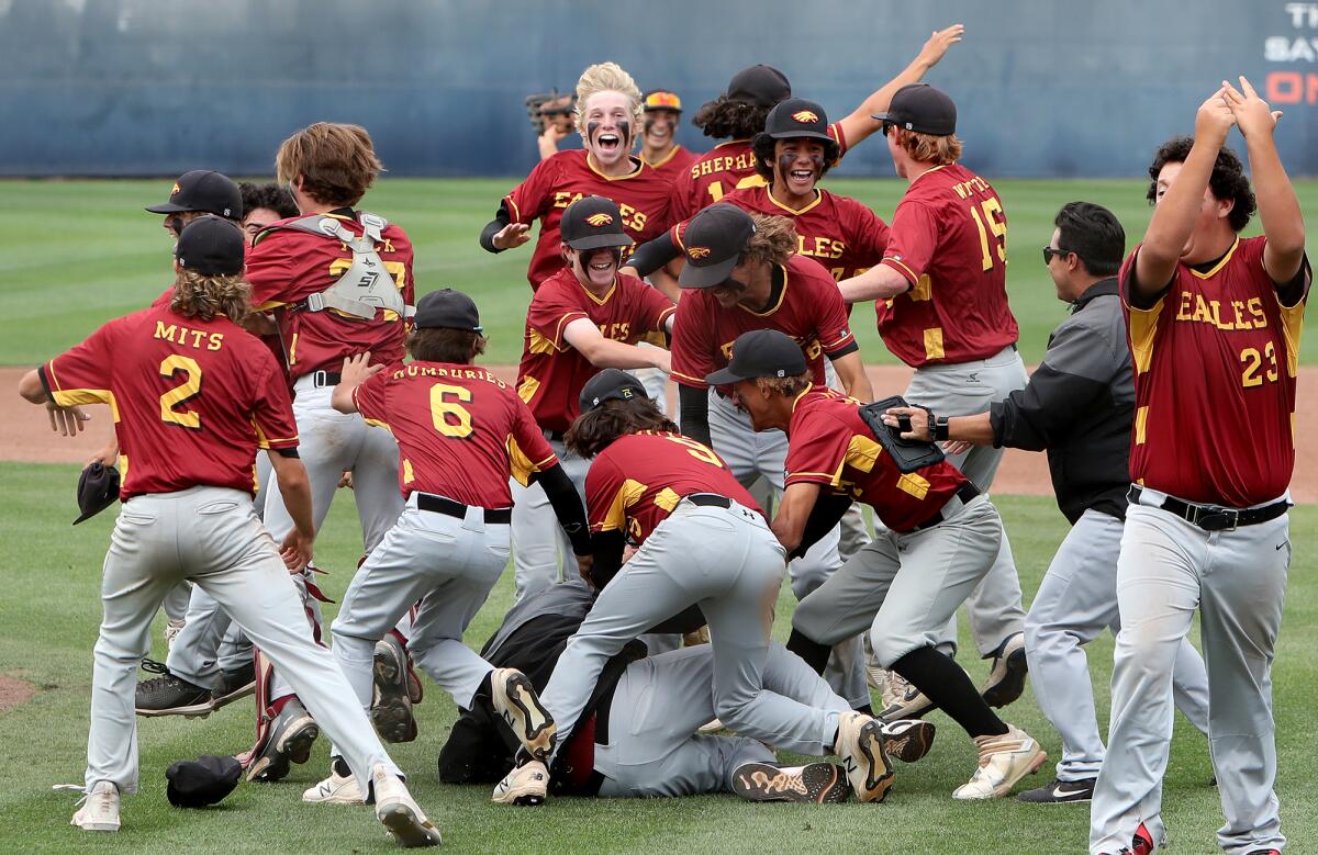 The Estancia baseball team celebrates beating Anaheim 2-1 in the CIF Southern Section Division 6 title game Saturday.