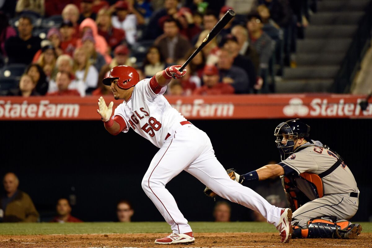Angels catcher Carlos Perez hits an RBI single against the Houston Astros last week.