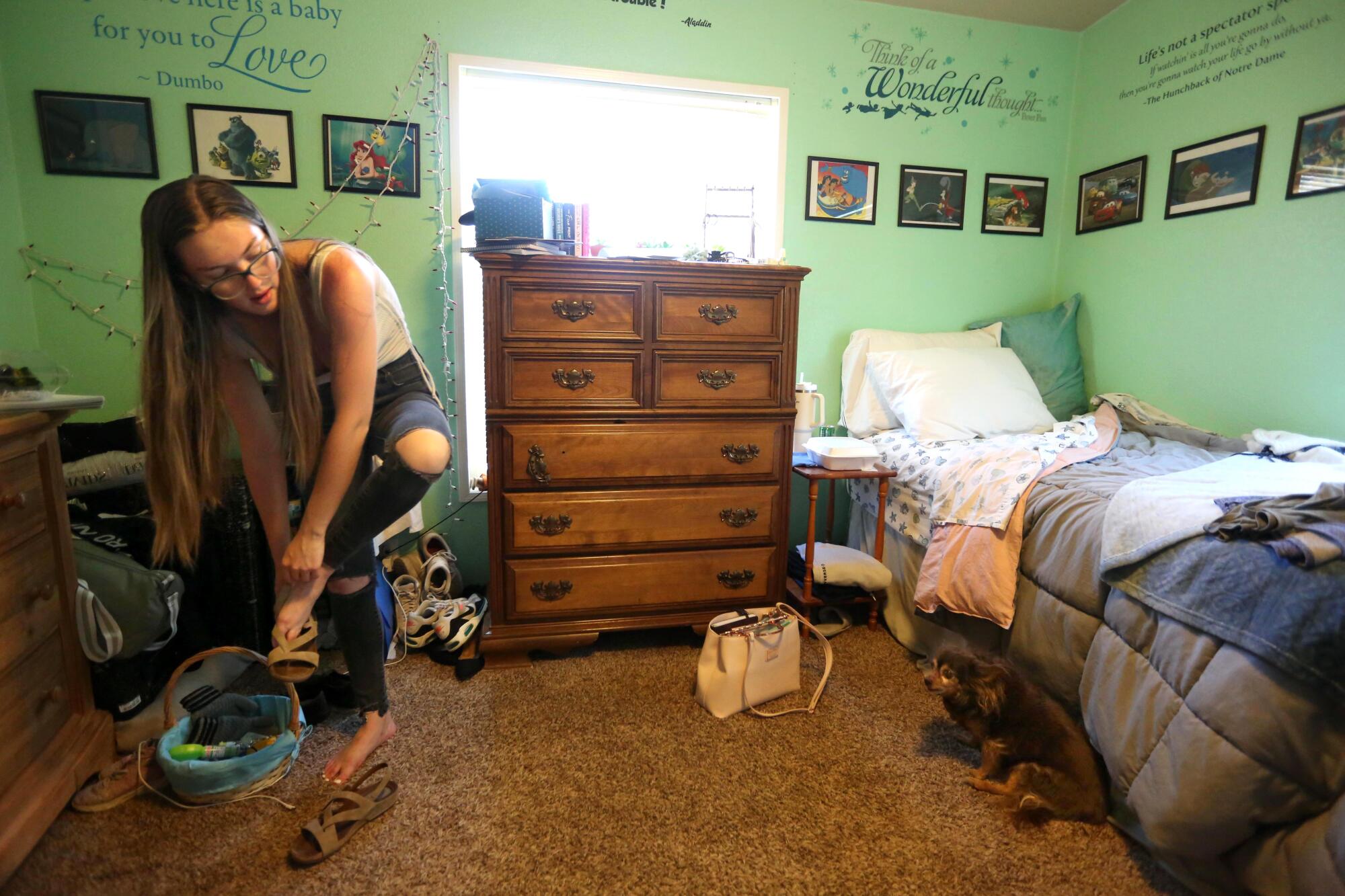 Linda Plumlee changes her shoes for work in her bedroom in Alturas.