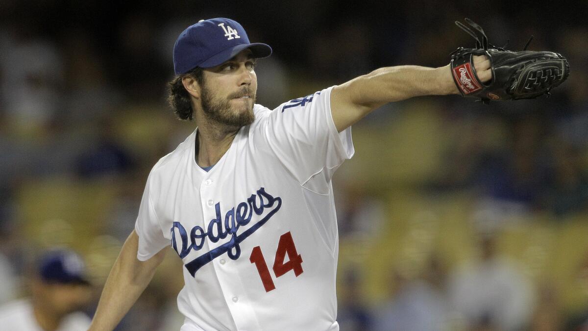 Dodgers starter Dan Haren delivers a pitch during the first inning of a 4-0 win over the San Diego Padres on Wednesday.