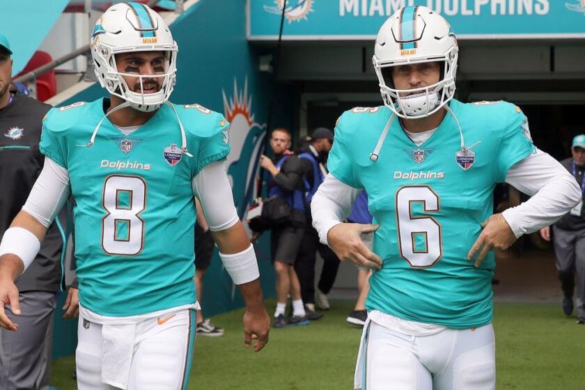 FILE - In this Oct. 1, 2017, file photo, Miami Dolphins quarterbacks Jay Cutler (6) and Matt Moore walk onto the field to warm-up before an NFL football game against New Orleans Saints at Wembley Stadium in London. Having a backup quarterback behind center on a short week usually means trouble. Not so for the Dolphins. Moore came on for injured Jay Cutler to cheers at Hard Rock Stadium and rallied the troops past the Jets. Now he starts at Baltimore. (AP Photo/Tim Ireland, File)