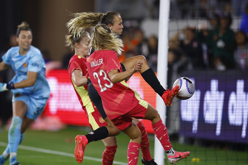 Angel City's Claire Emslie scores in the 76th minute of a 2-2 draw with Portland at BMO Stadium.