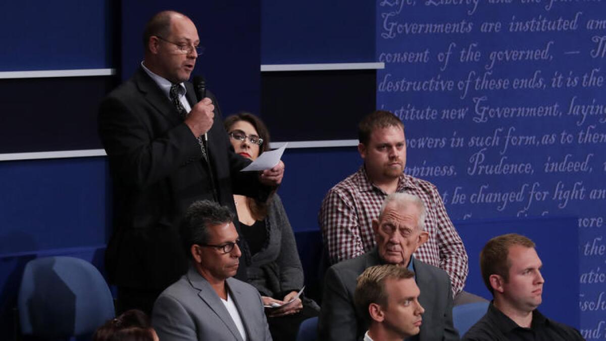 Ken Karpowicz asks a question during the town hall debate.