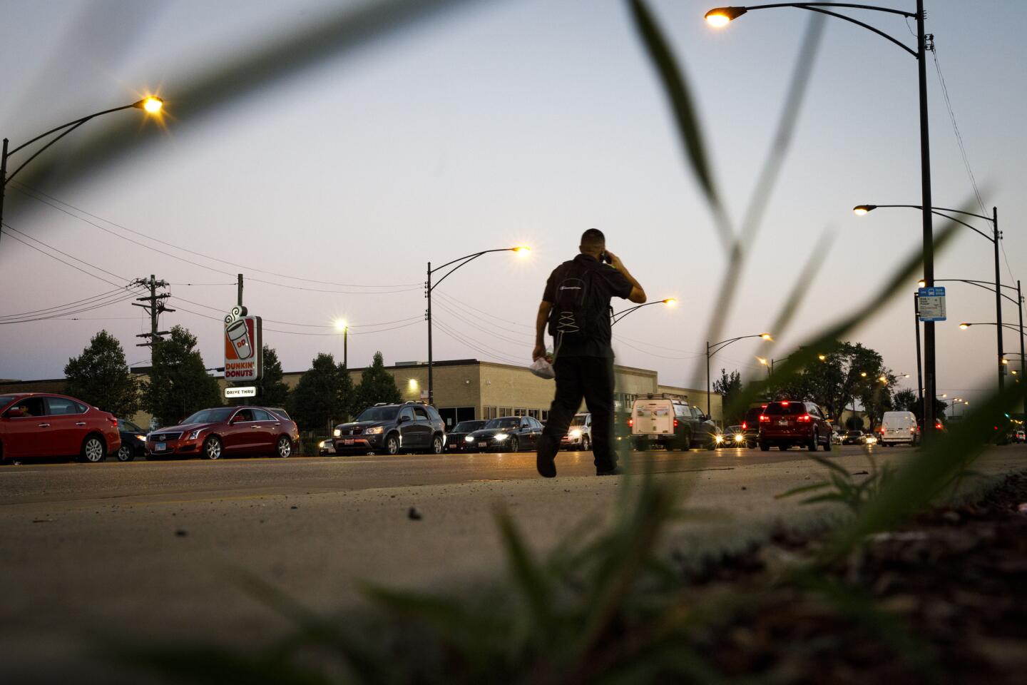 A person walks on the sidewalk in the 4100 block of South Pulaski Road on Sept. 13, 2018, near the location where Laquan McDonald was shot by Chicago police officer Jason Van Dyke in 2014.