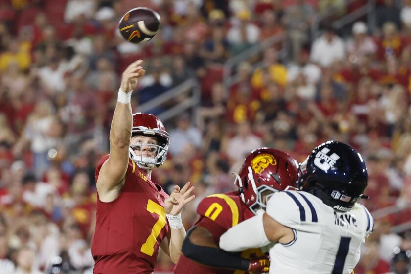 Los Angeles, CA - September 07: USC starting quarterback Miller Moss, #7, left.