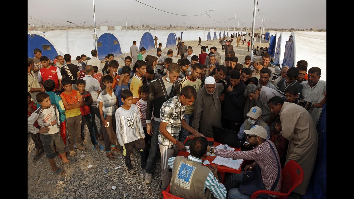 As many Iraqis return home, others are fleeing the fighting in villages surrounding Mosul. At a camp for the displaced, about 3,000 people arrived in a week, but many more are expected as the fight for Mosul continues. New arrivals line up for food supplies, provide by the World Food Program.