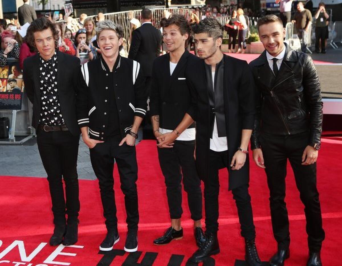 One Direction members Harry Styles, left, Niall Horan, Louis Tomlinson, Zayn Malik and Liam Payne attend the world premiere of "One Direction: This Is Us" in London on Tuesday.