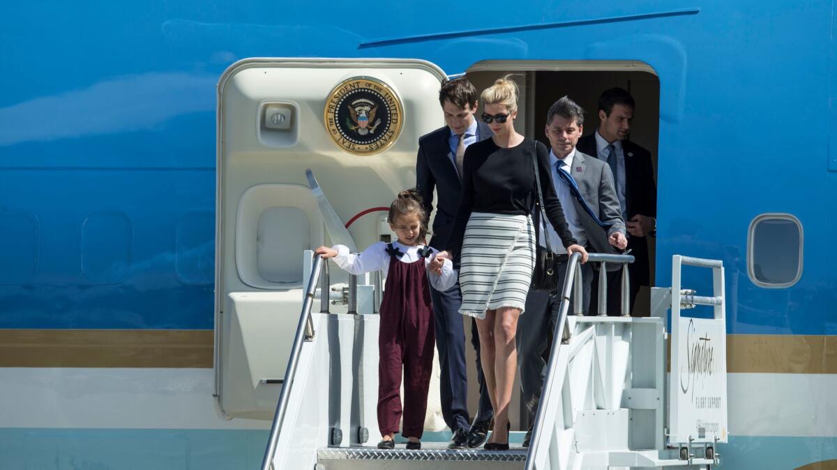 Ivanka Trump, her daughter Arabella and husband Jared Kushner arrive on Air Force One in Florida.