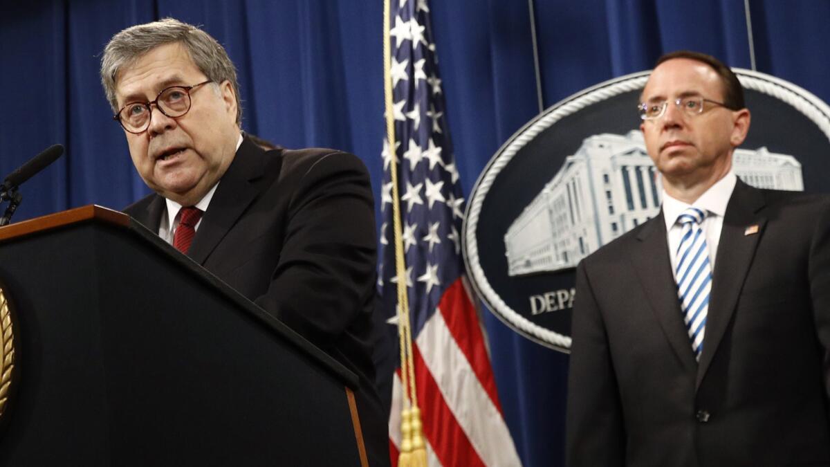 Atty. Gen. William P. Barr speaks alongside Deputy Atty. Gen. Rod Rosenstein about the release of a redacted version of special counsel Robert S. Mueller III's report during an April 18 news conference at the Justice Department.