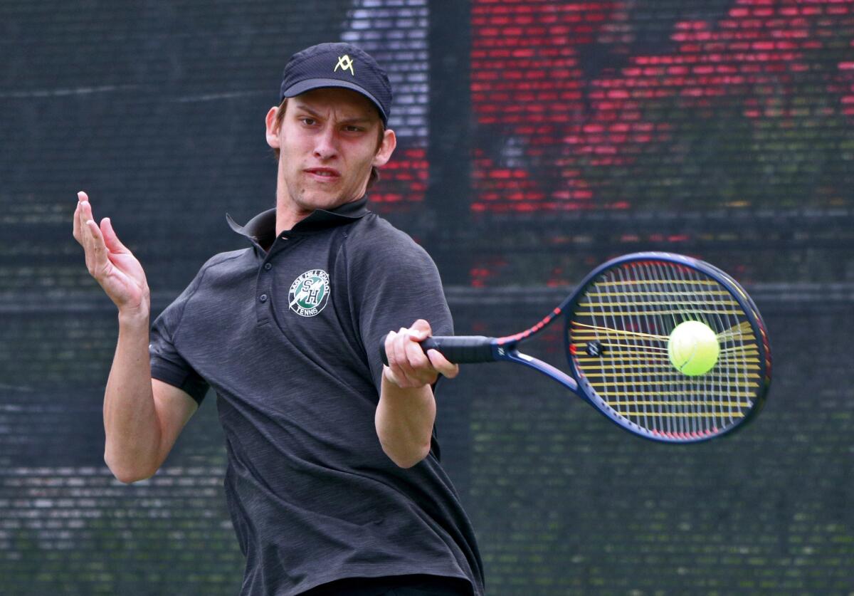 Sage Hill School singles player Emin Torlic returns the ball against Beckman in the CIF Southern Section Division 1 championship match at the Claremont Club on Friday.