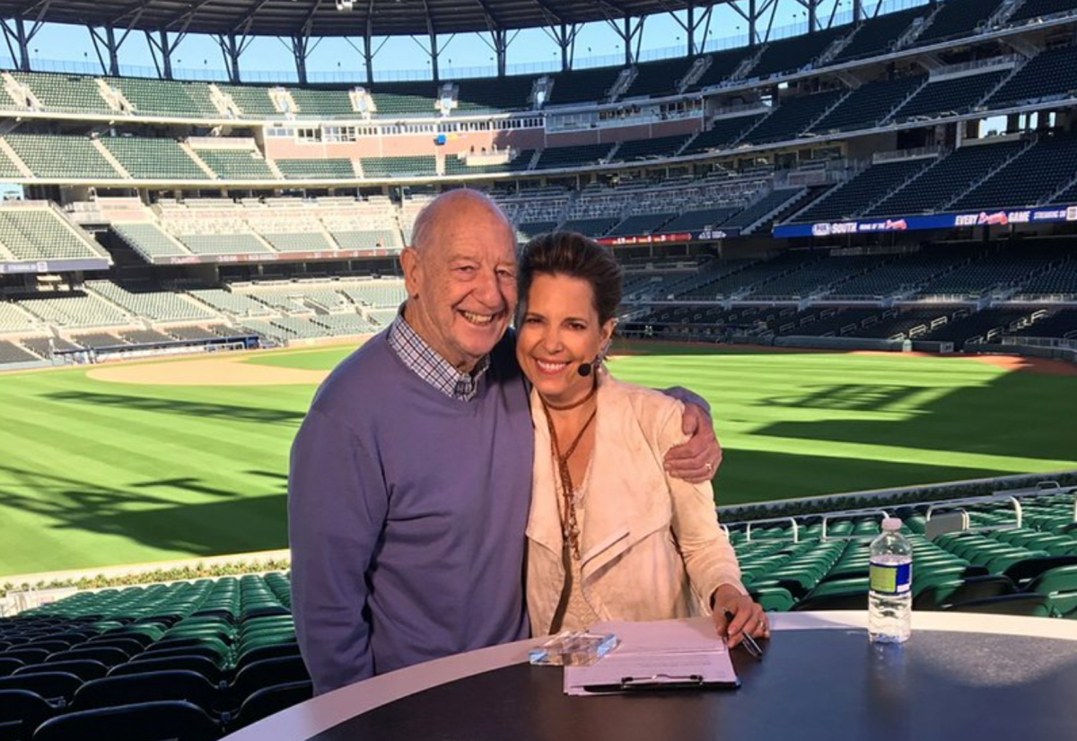 Mike Storen poses with his daughter Hannah Storm at Truist Park in Atlanta in March 2017.