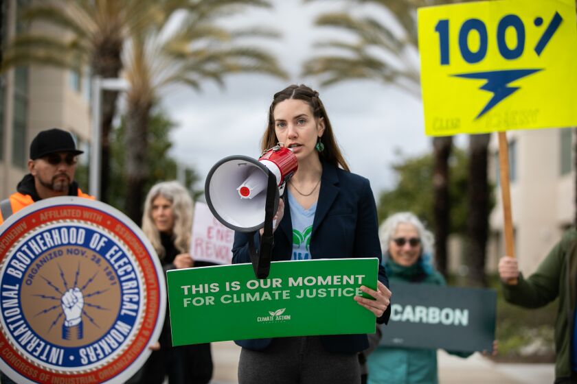 San Diego, CA - March 23: Serena Pelka with the Climate Action Campaign speaks at a rally to demand the San Diego Community Power Board of Directors commits to achieving 100 percent renewable power within the next 12 years at the County Operations Center in San Diego, CA on Thursday, March 23, 2023. (Adriana Heldiz / The San Diego Union-Tribune)