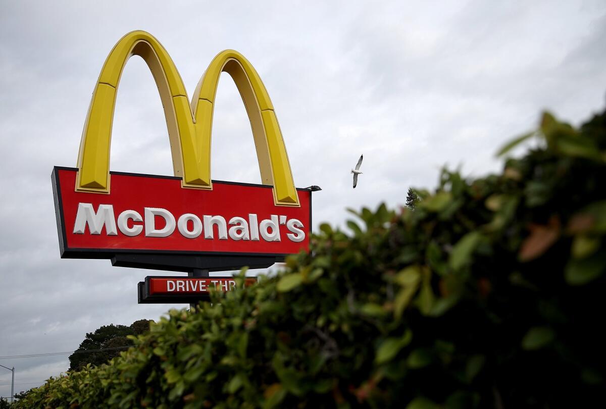 Employees at an Oakland McDonald's went on strike Tuesday after four workers and their family members tested positive for COVID-19.