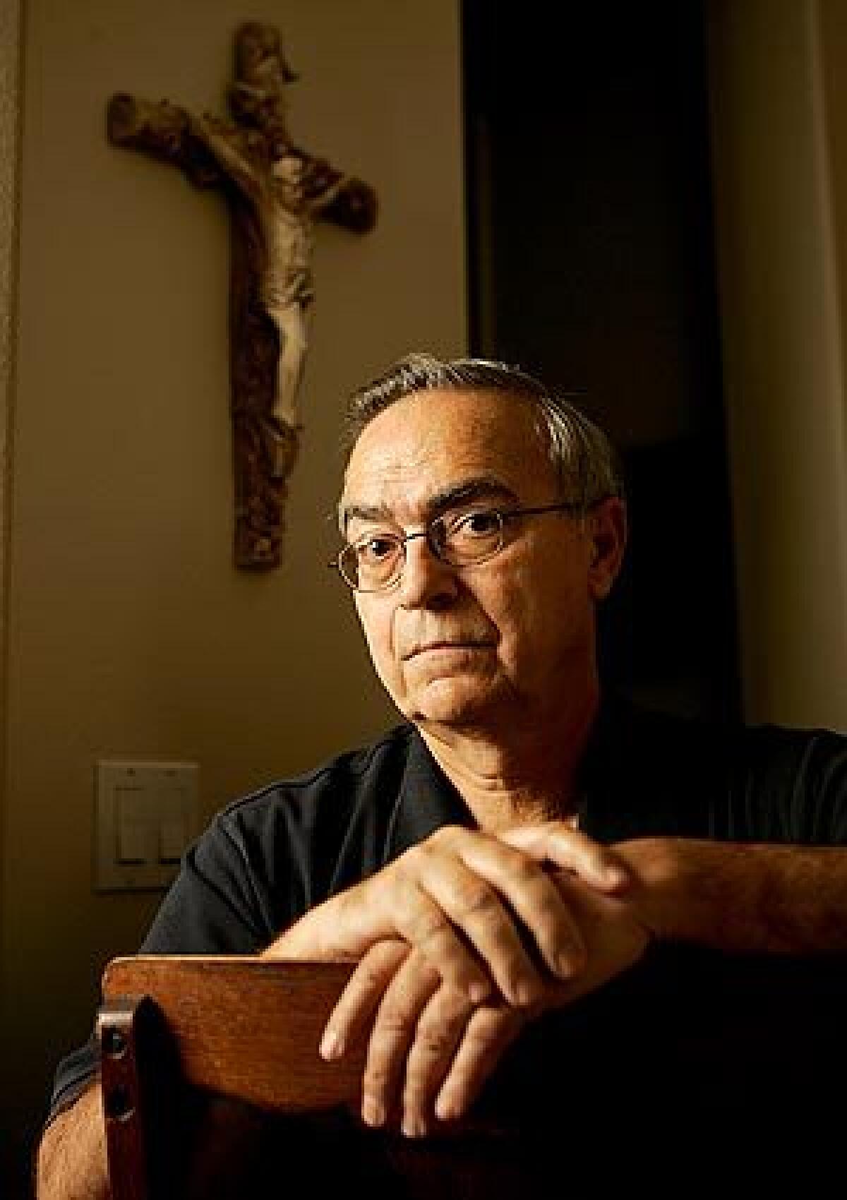 Donald Ashman, seen at his Thousand Oaks home, is an Anglican priest who was a passenger on the Metrolink train that crashed Friday in Chatsworth. Though still in a daze from the collision, he administered last rites to people who died at the scene.
