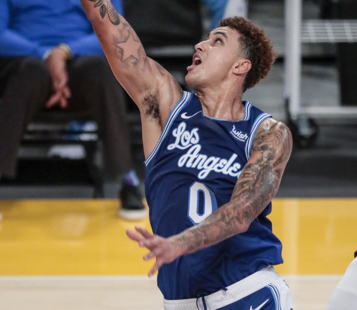 Lakers forward Kyle Kuzma puts up a shot against the Minnesota Timberwolves.