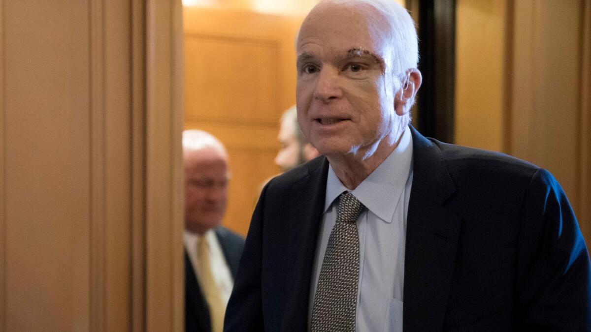 Senator John McCain (R-AZ) on his way to vote on the motion to proceed on President Trump's effort to repeal and replace Obamacare in Washington on July 25.