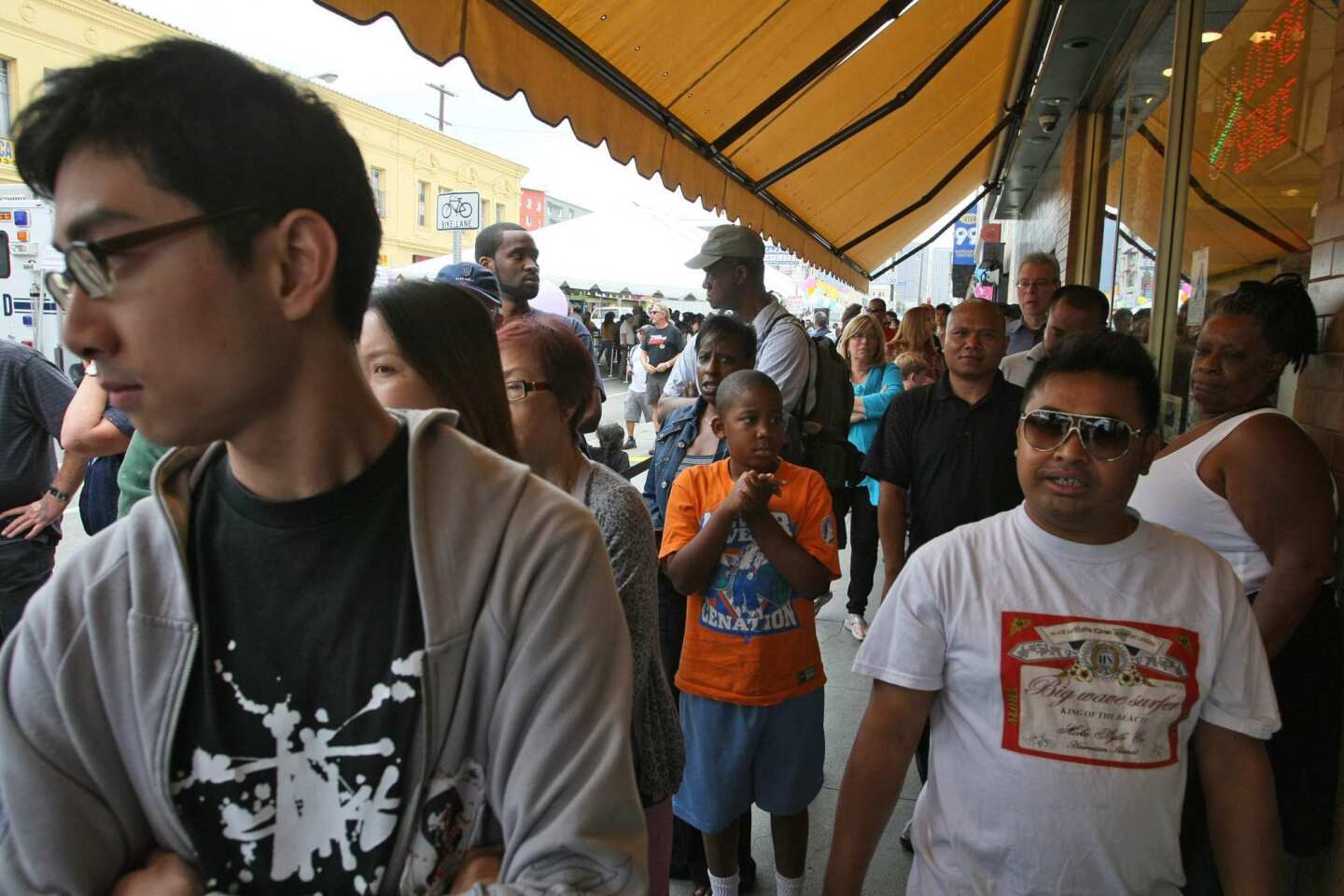 Customers wait outside Langer's Deli in Los Angeles. The landmark restaurant at 7th and Alvarado streets near MacArthur Park is giving away free No. 19s -- its most popular sandwich -- through Saturday.