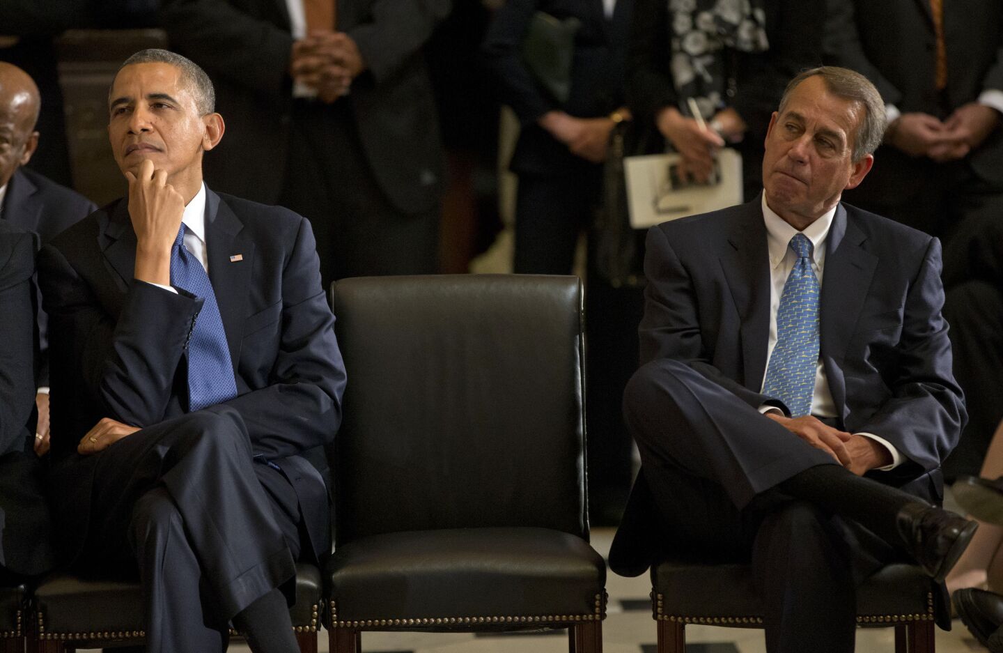 President Obama sits with House Speaker John A. Boehner during memorial service for former House Speaker Tom S. Foley.