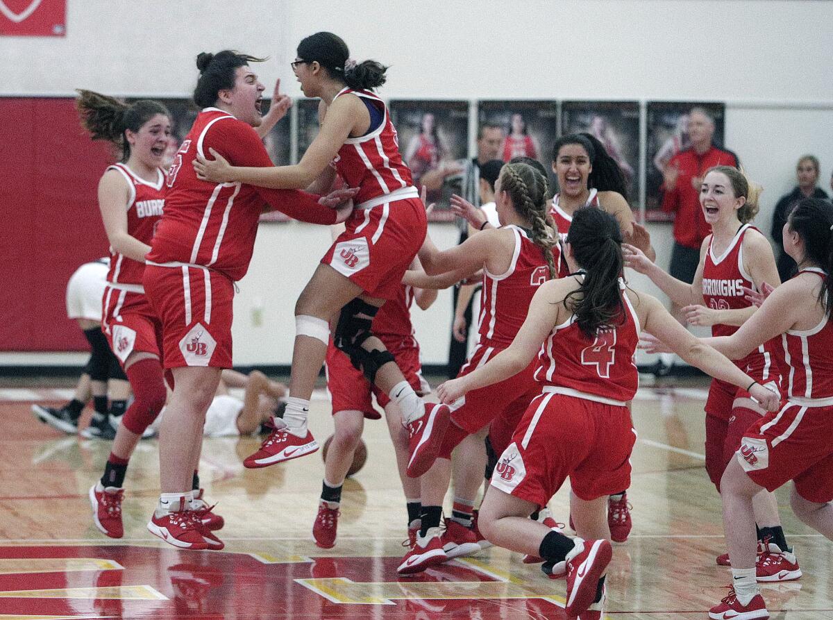 Burroughs' Sydney Martin and Isabella Roderick jump together to celebrate victory against Whittier Christian in Wednesday's CIF Division II-A quarterfinal game.