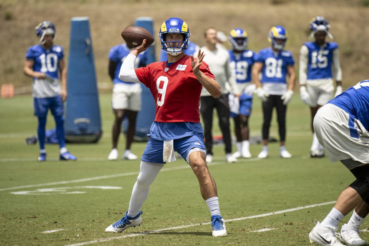  Rams quarterback Matthew Stafford (9) throws a pass during camp.