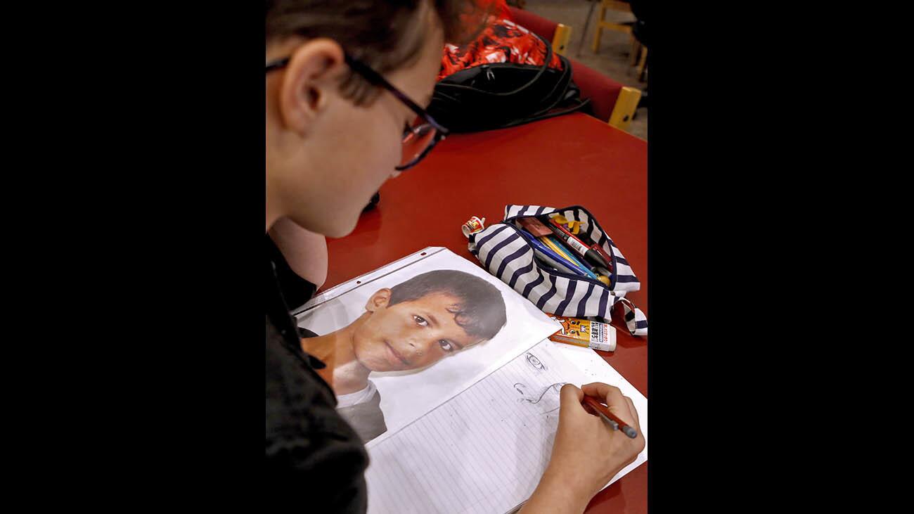 Photo Gallery: Burroughs High School students work on Portraits of Kindness project