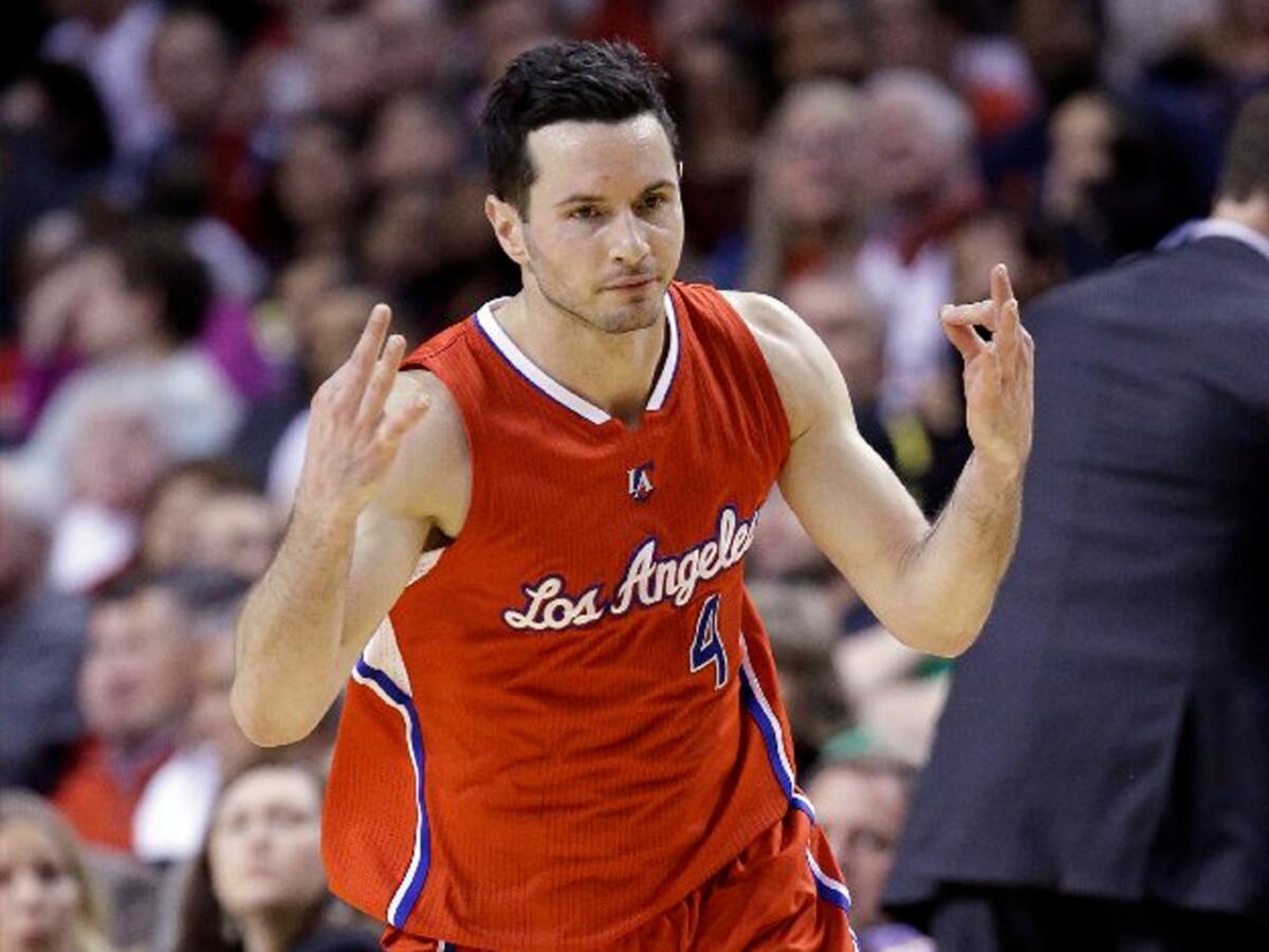 Clippers shooting guard J.J. Redick celebrates making a three-point shot during the Clippers' second half comeback against the Trail Blazers.