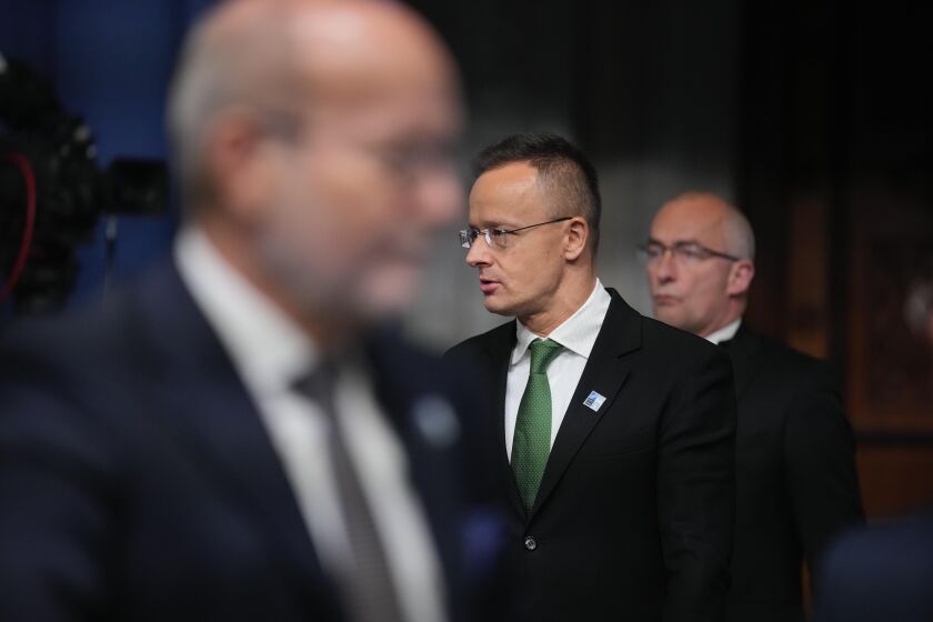 Hungary's Foreign Minister Peter Szijjarto attends the second day of the meeting of NATO Ministers of Foreign Affairs in Bucharest, Romania, Wednesday, Nov. 30, 2022. (AP Photo/Andreea Alexandru)
