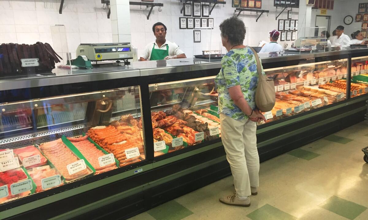 Specialties at the meat counter at Alpine Village Market include a wide variety of housemade sausages.