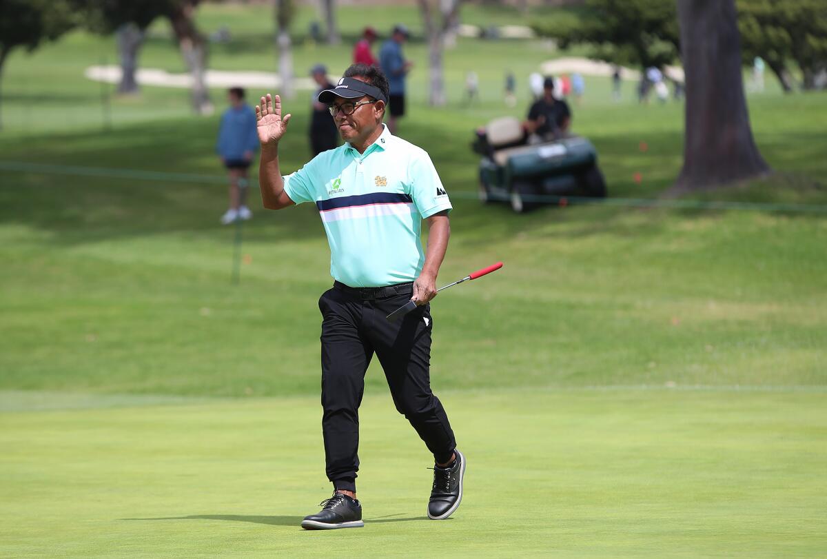 Tournament leader Thongchai Jaidee acknowledges the gallery after making birdie on the 14th hole at the Hoag Classic.