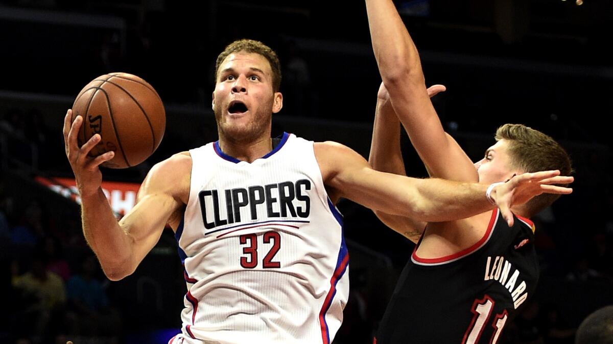 Clippers forward Blake Griffin goes up for a shot against Trail Blazers center Meyers Leonard in the second quarter Thursday night.