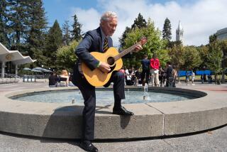 BERKELEY CALIF. AUGUST 22, 2024 - UC Berkeley's new chancellor, Rich Lyons, in a portrait outside the Student Union, sings "Bare Necessities" after convocation held at Haas Pavilion on Thursday, Aug. 22, 2024 in Berkeley, Calif. (Paul Kuroda / For The Times)