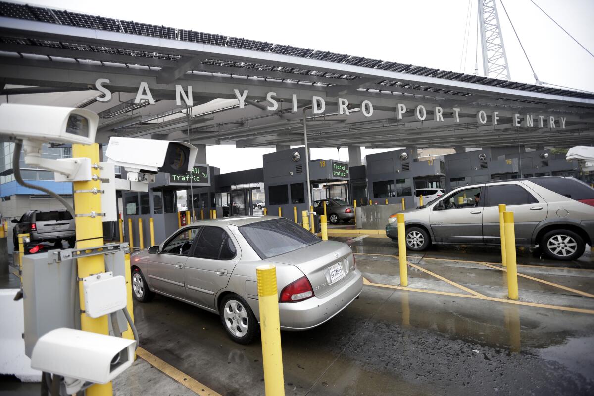 Cars wait to enter the United States from Tijuana, Mexico through the San Ysidro port of entry in San Diego. 