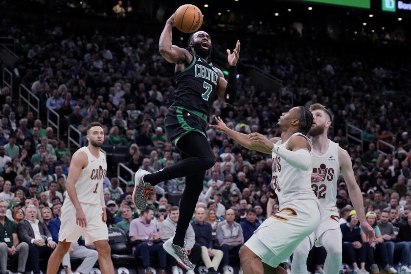 Boston Celtics guard Jaylen Brown (7) drives to the basket against the Cleveland Cavaliers during the second half of Game 5 of an NBA basketball second-round playoff series Wednesday, May 15, 2024, in Boston. The Celtics advanced to the Eastern Conference finals (AP Photo/Charles Krupa)