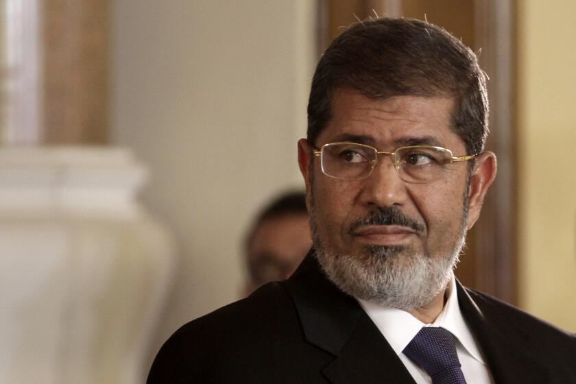Mohamed Morsi, seen in 2012, maintains he is still Egypt's legitimate leader, a Turkish news report said.