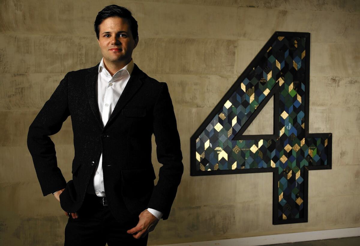 Designer Brian Gennett has constructed giant numbers out of book covers for each floor in Barker Block, a loft building downtown.