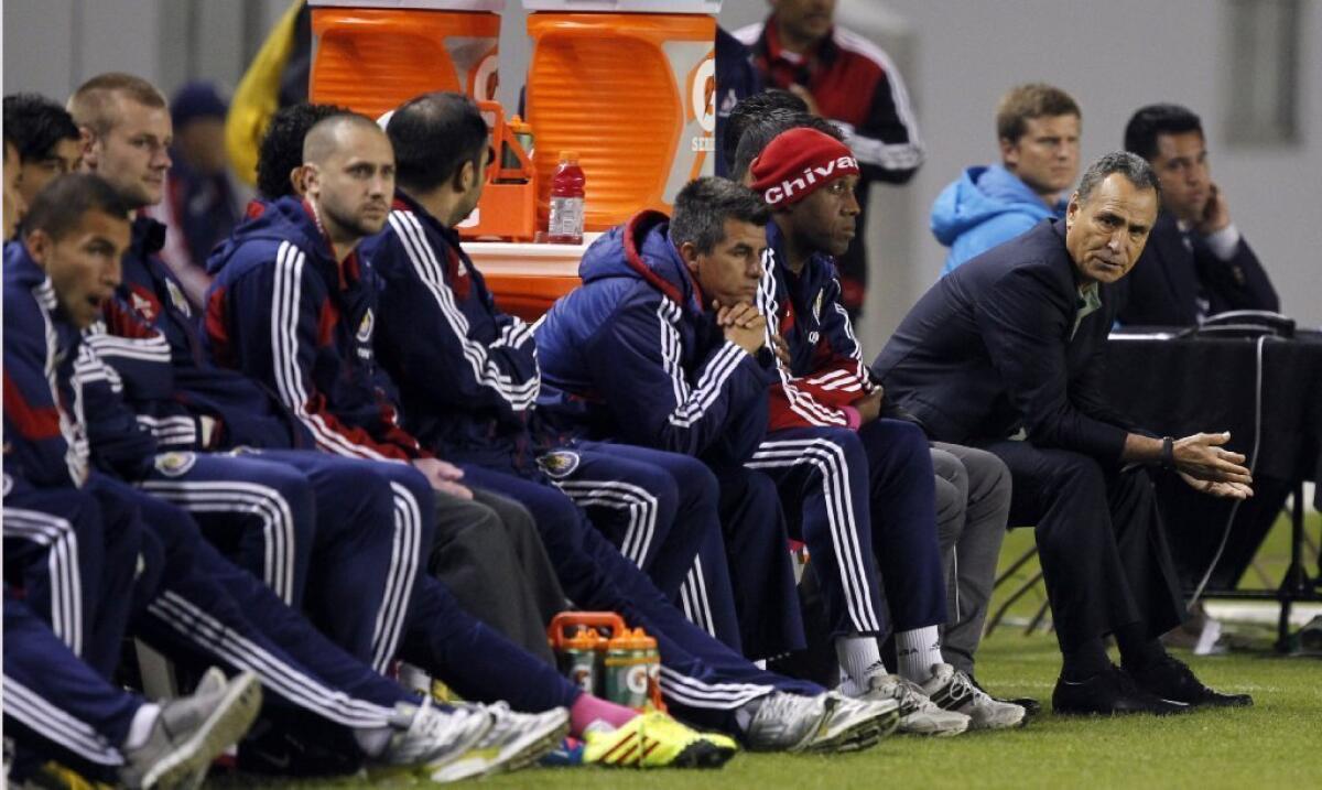 Members of Chivas USA sit on the bench on Oct. 26.