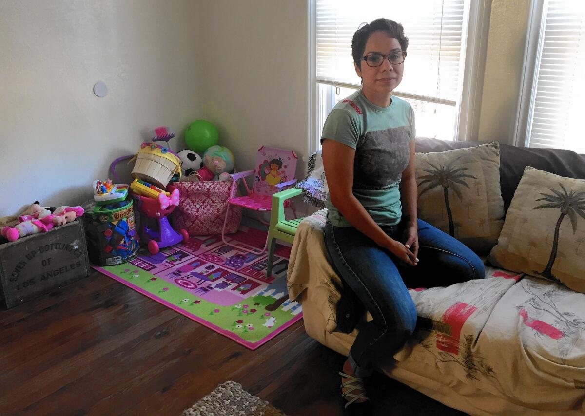 Navy veteran Laura Estrada in the West Adams apartment she found with help from the Downtown Women's Center. Estrada was honorably discharged in 2001, and she's since had to deal with the PTSD caused by the harassment and humiliation she suffered during her four-year tour of duty.