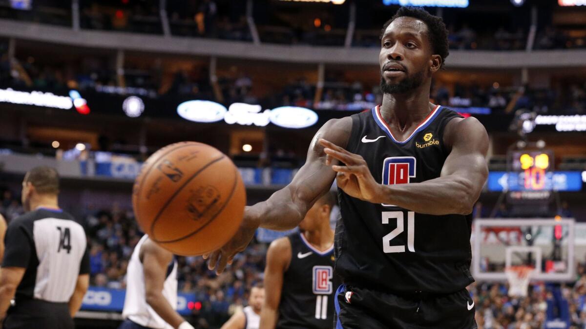 Clippers guard Patrick Beverley throws a ball along the sideline where Dallas Mavericks fan Don Knobler was sitting during a game on Dec. 2. Beverley was ejected for throwing the ball.