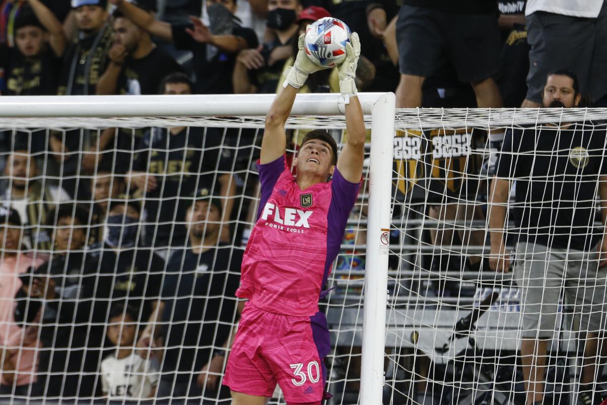 Los Angeles FC goalkeeper Tomas Romero jumps to stop a shot against the Vancouver Whitecaps.